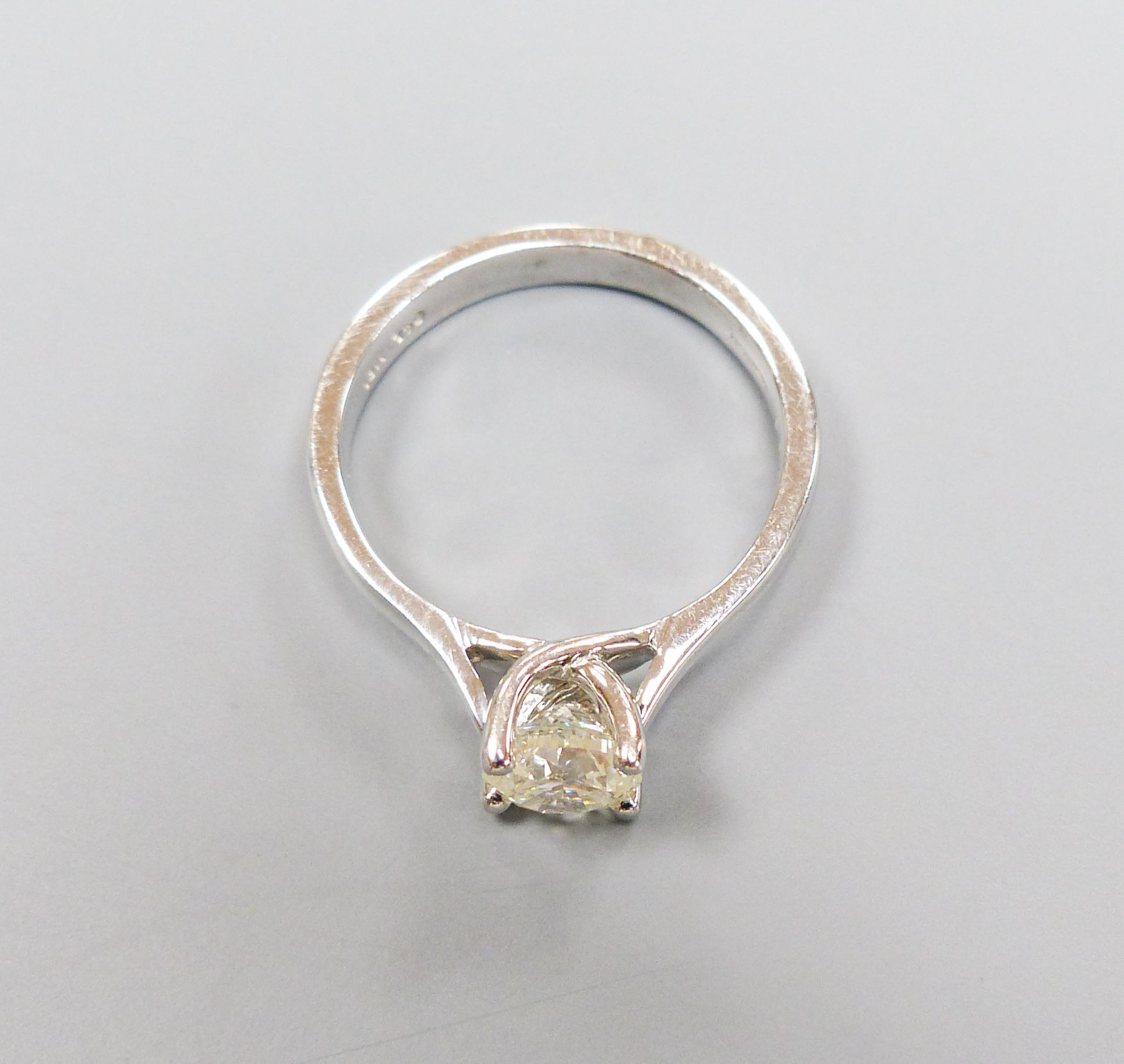 A modern white gold and solitaire diamond ring, size N, gross weight 4.6 grams